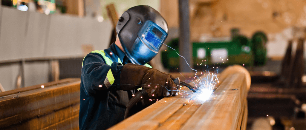 Man working on a modular dust collection system